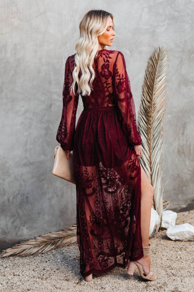Elegant Lace Maxi Dress with Deep V-Neck and Sheer Long Sleeves